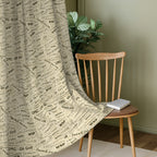 Ivory Black Typography Tales 240 GSM Polyester 80% Blackout Eyelet Curtain